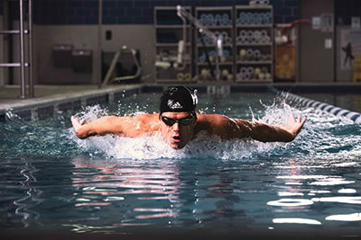 Michael Andrew competes in one of his strongest events, the 100-meter butterfly.